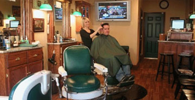 Man getting a haircut at Interior image of VanRyn's Barber shop in West Chester, PA